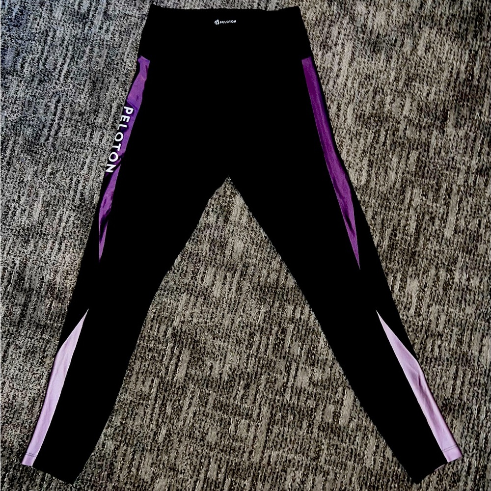 Peloton black leggings with purple ombré sides.